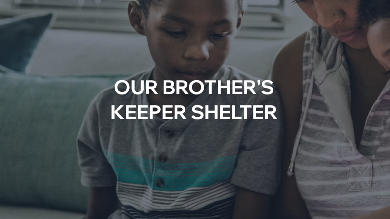 Our Brother's Keeper shelter website homepage with the organization mark and family photography